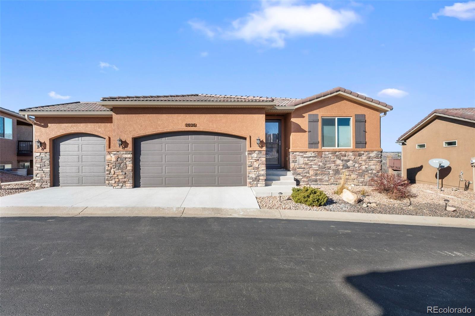 a front view of a house with a garage