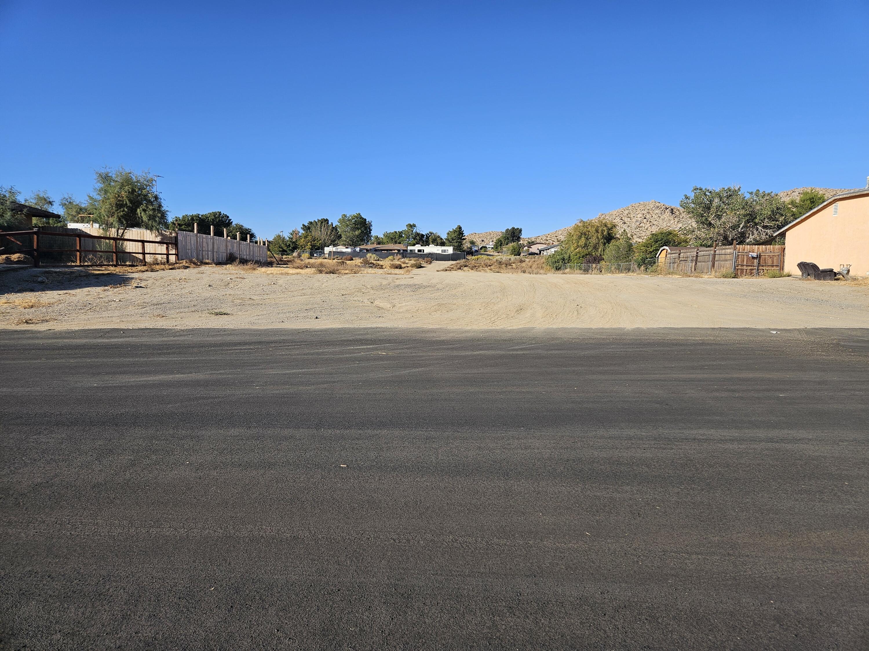 a view of a road with an ocean view