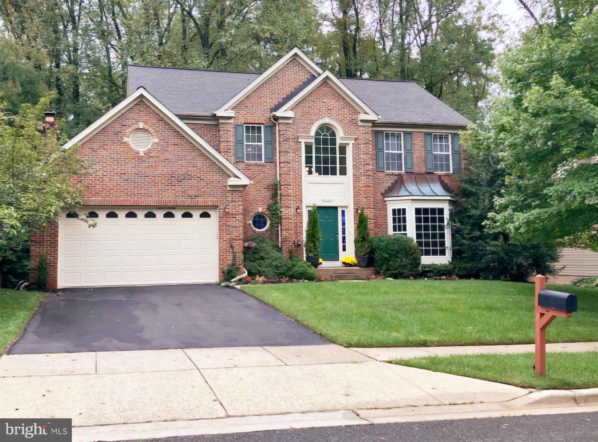 a view of a yard in front view of a house