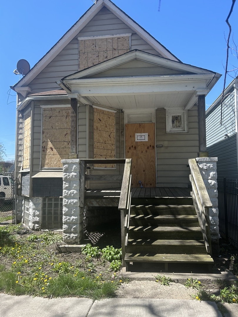 a front view of a house with stairs