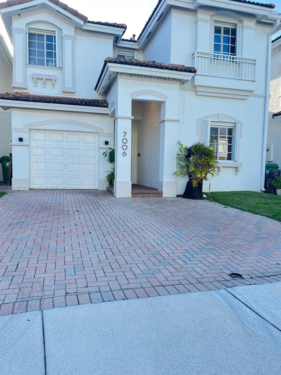 front view of a house with a patio