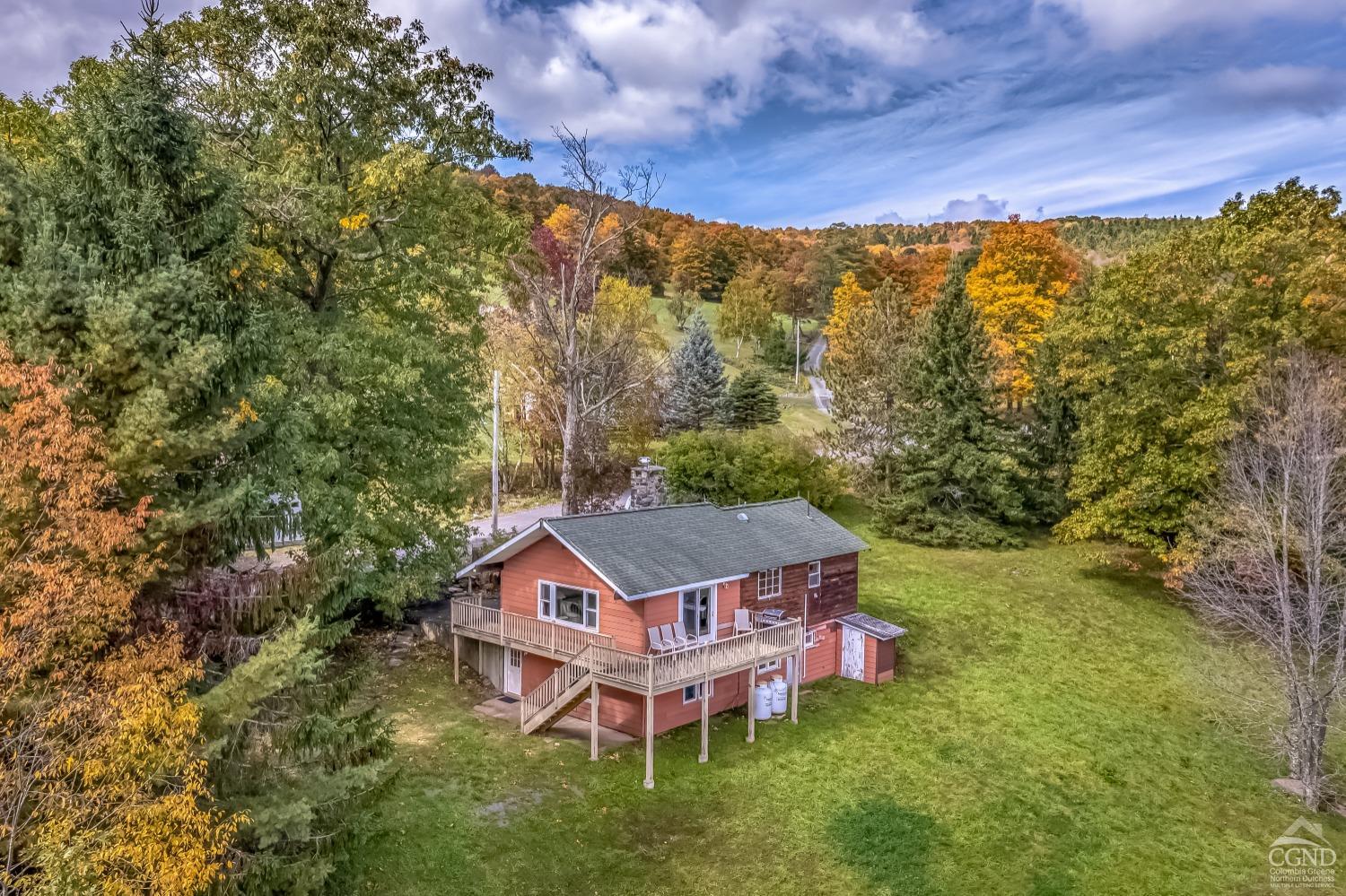 a aerial view of a house with a big yard