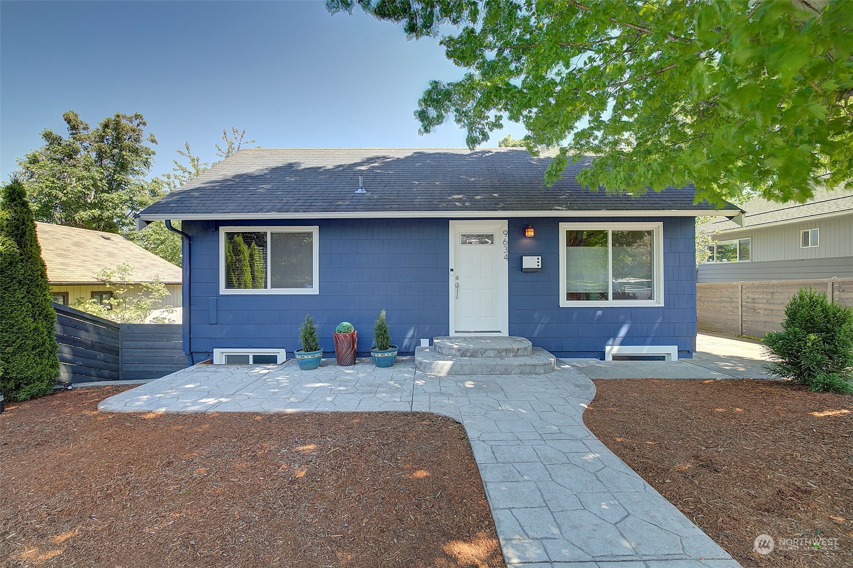 a front view of house with yard outdoor seating and barbeque oven