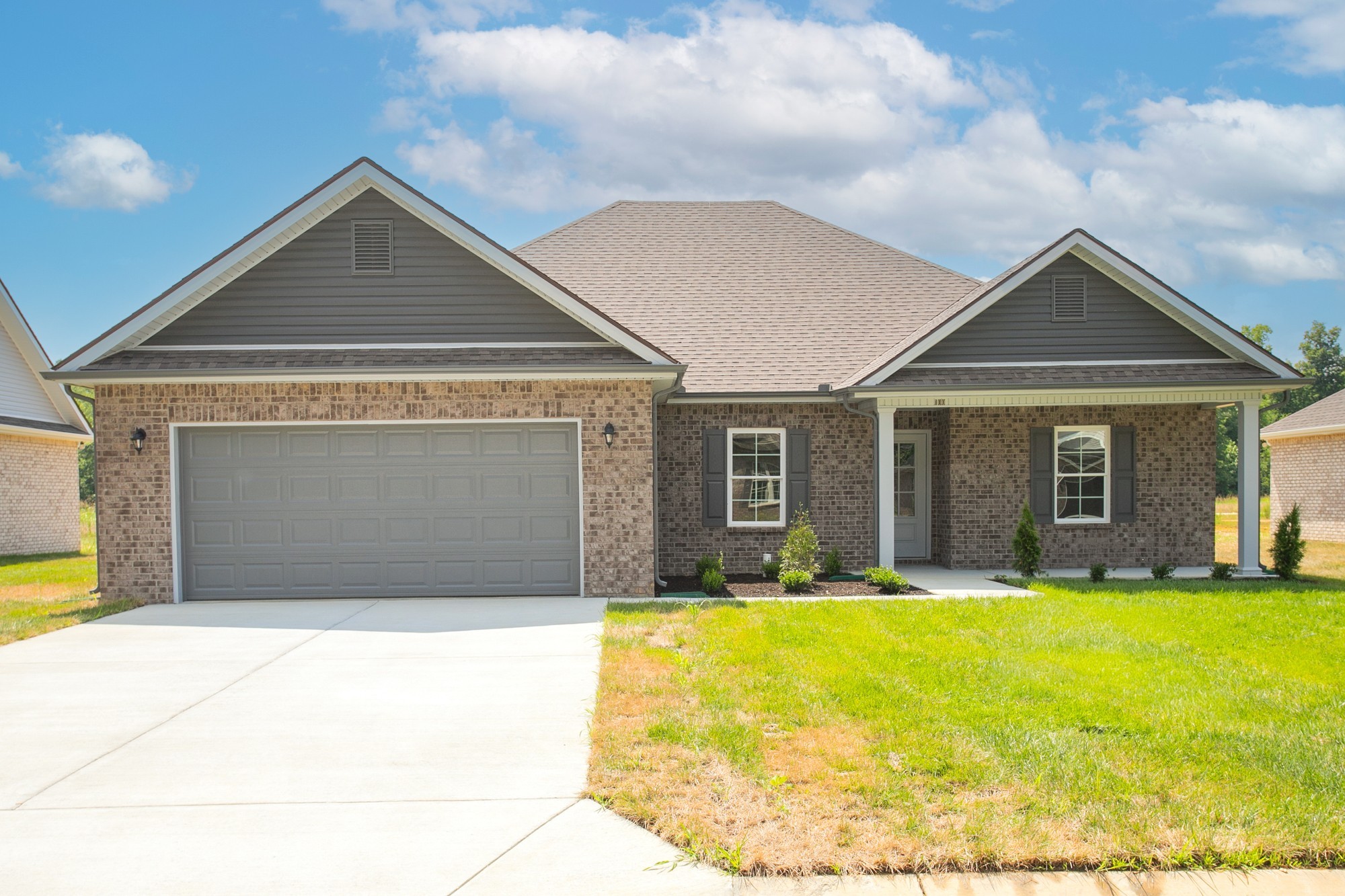 a front view of house with yard outdoor seating and barbeque oven