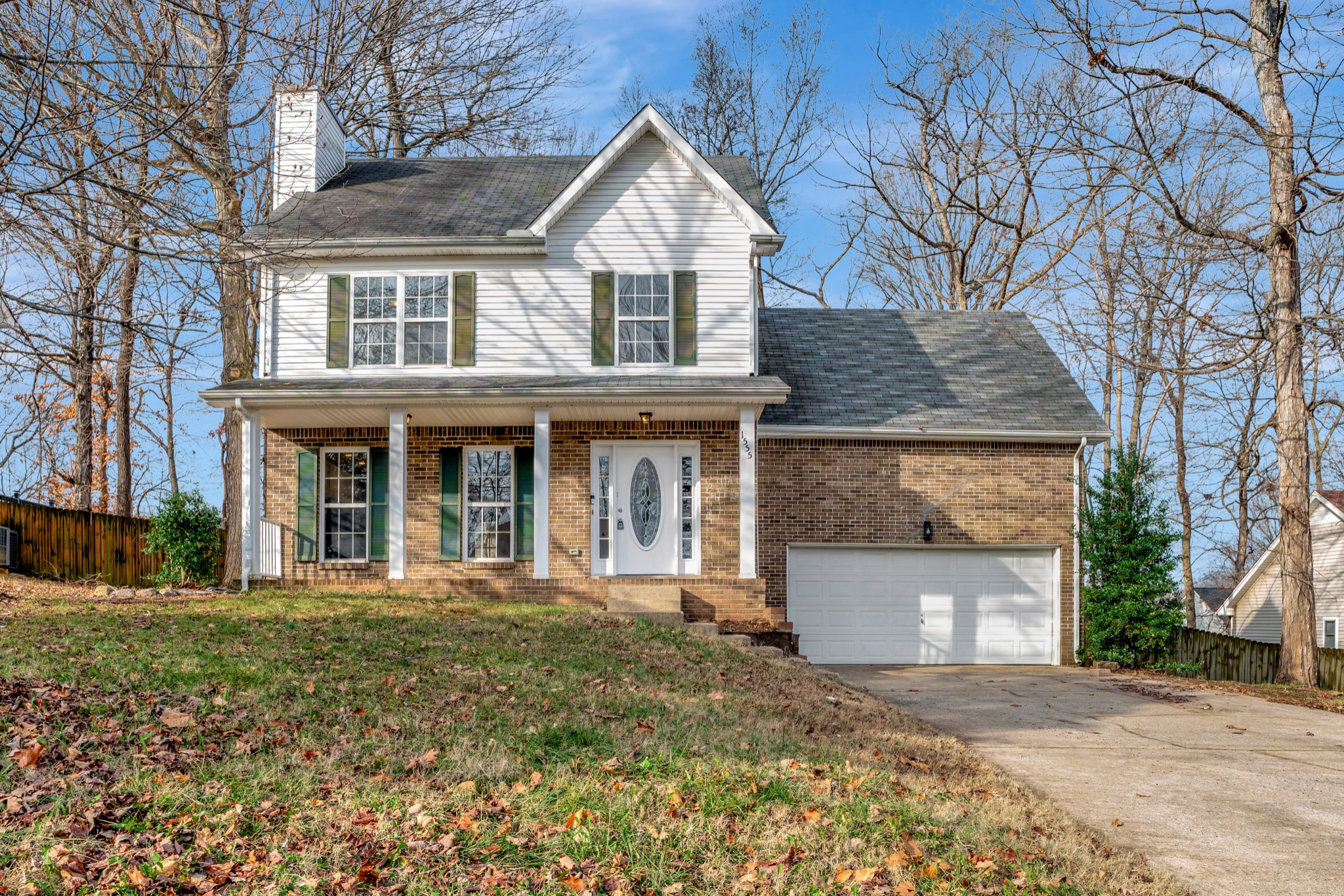 front view of a house with a yard