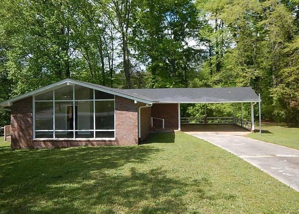 front view of a house with a yard