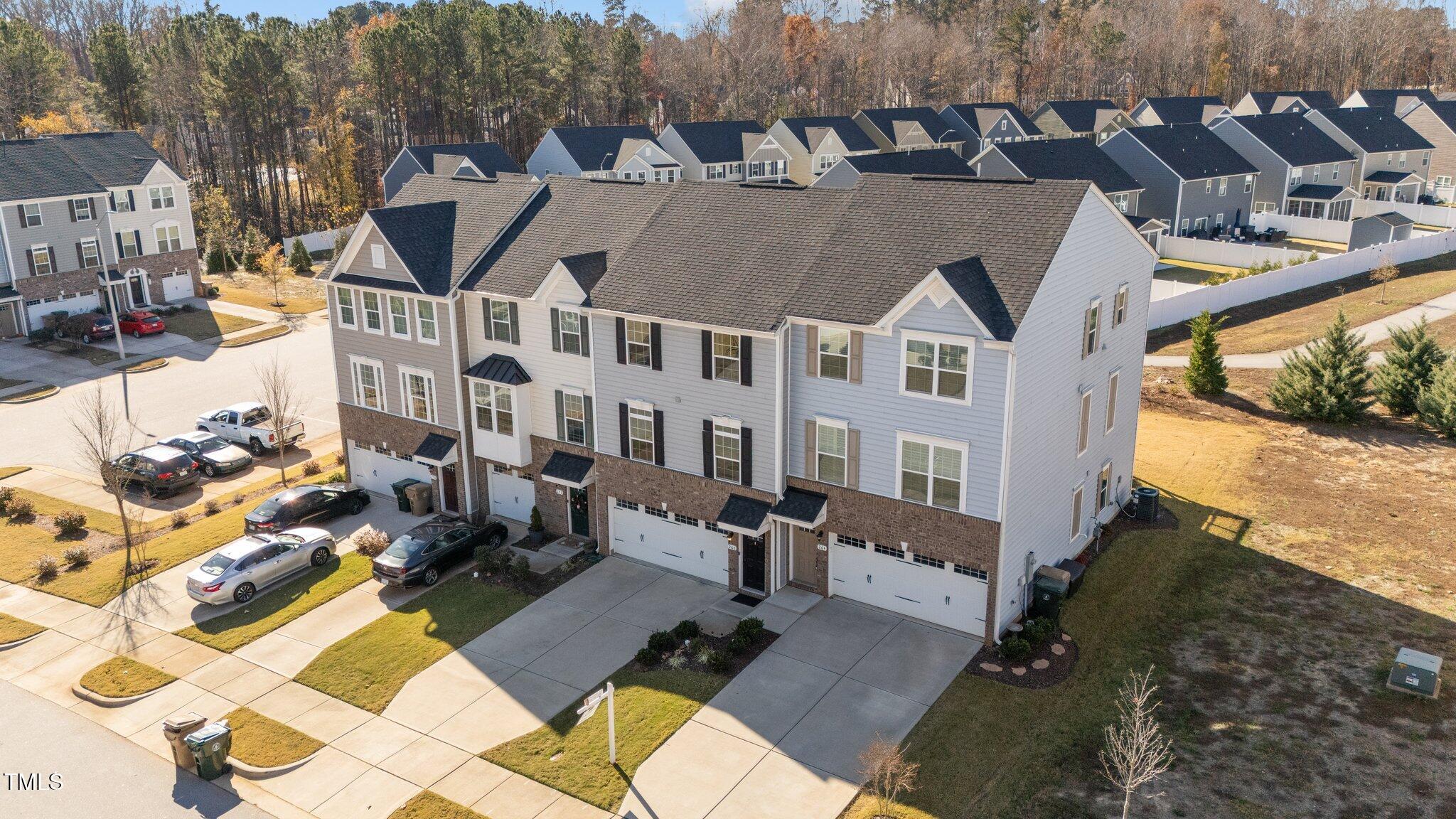 a aerial view of a house with a yard