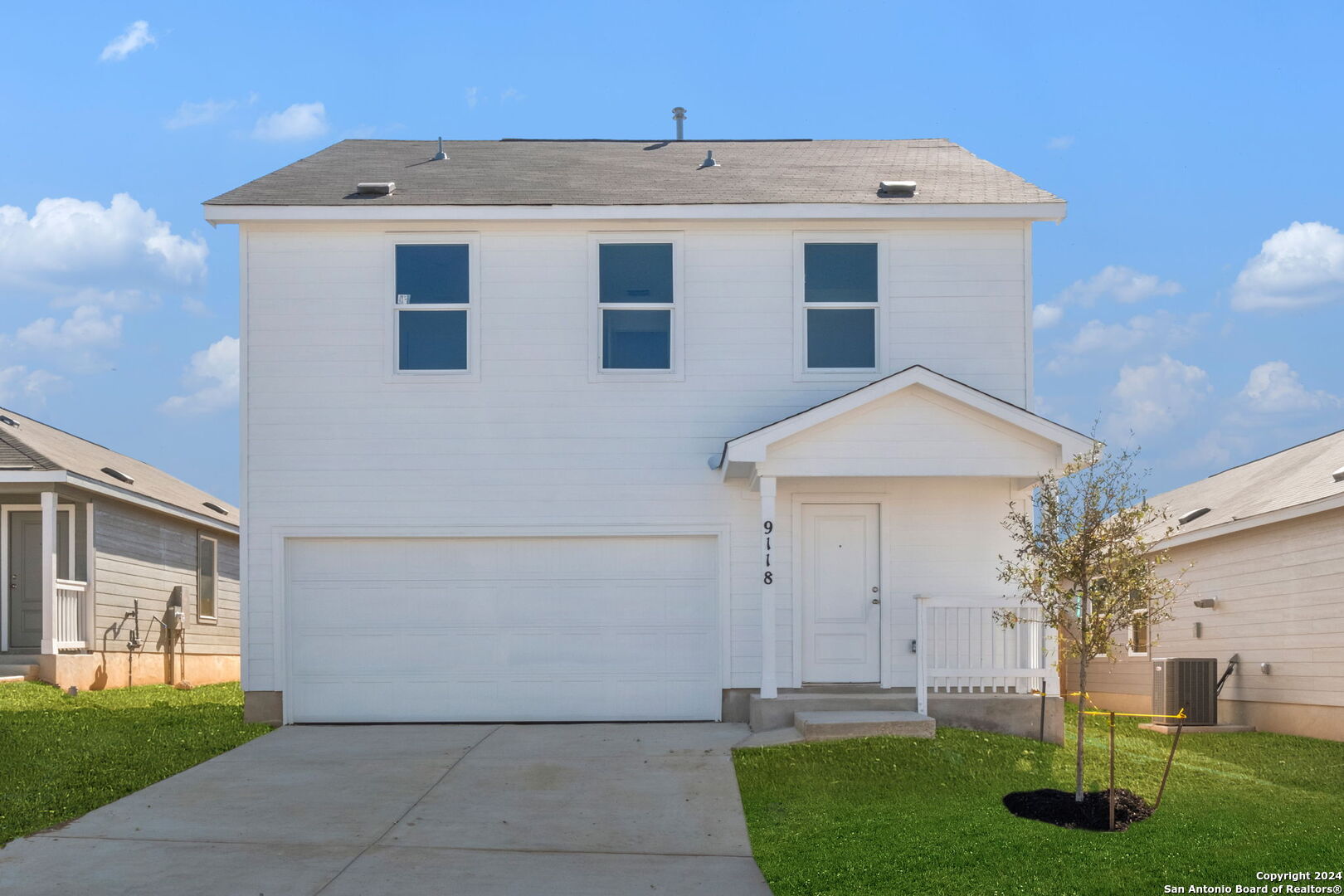 a front view of a house with a yard