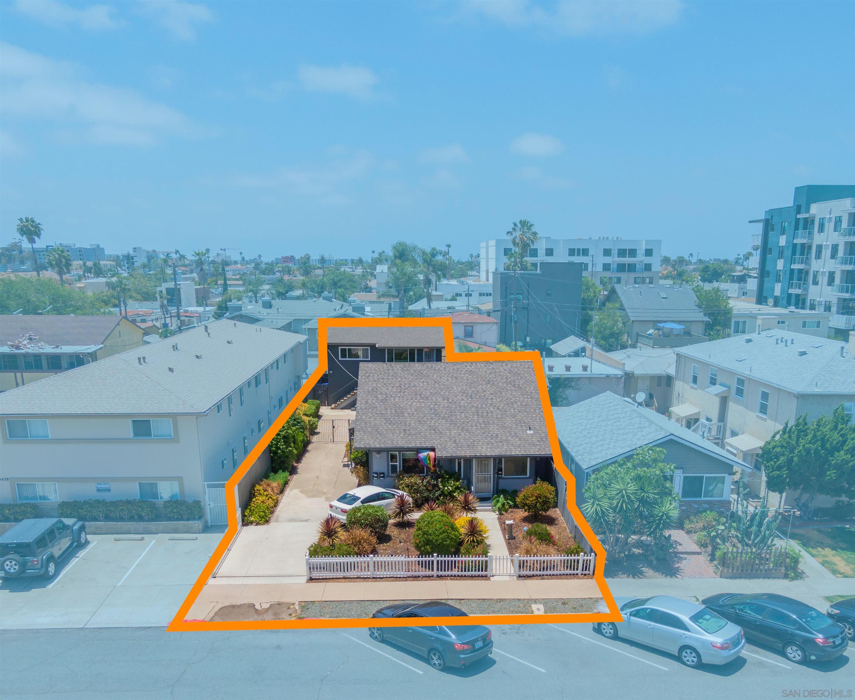 an aerial view of a house with swimming pool