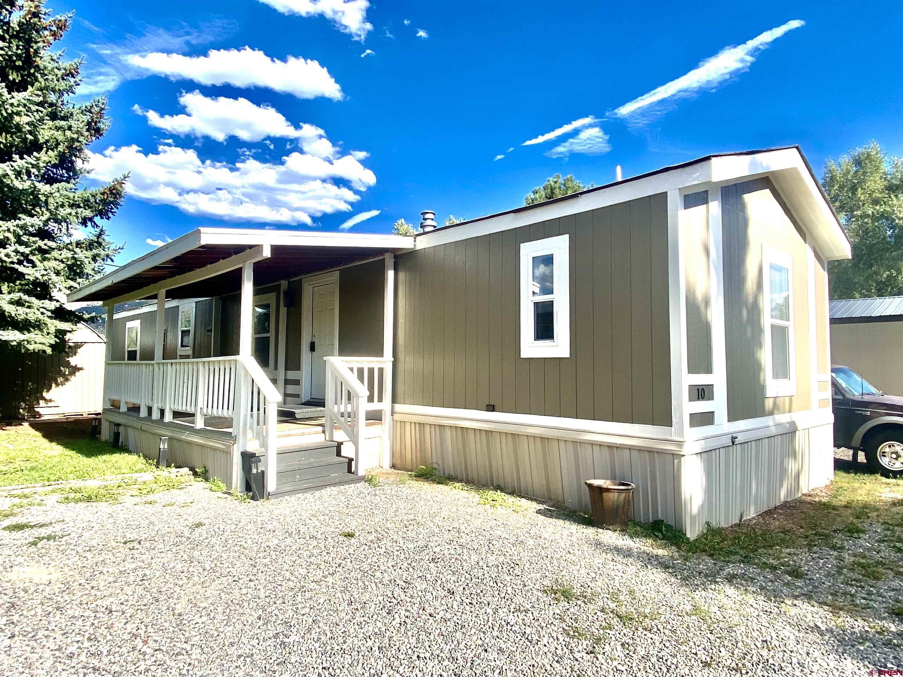 a front view of a house with a porch