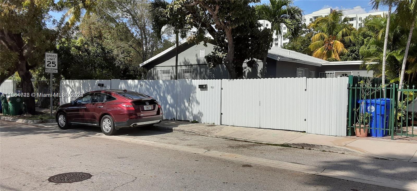 a view of a car parked in front of a house