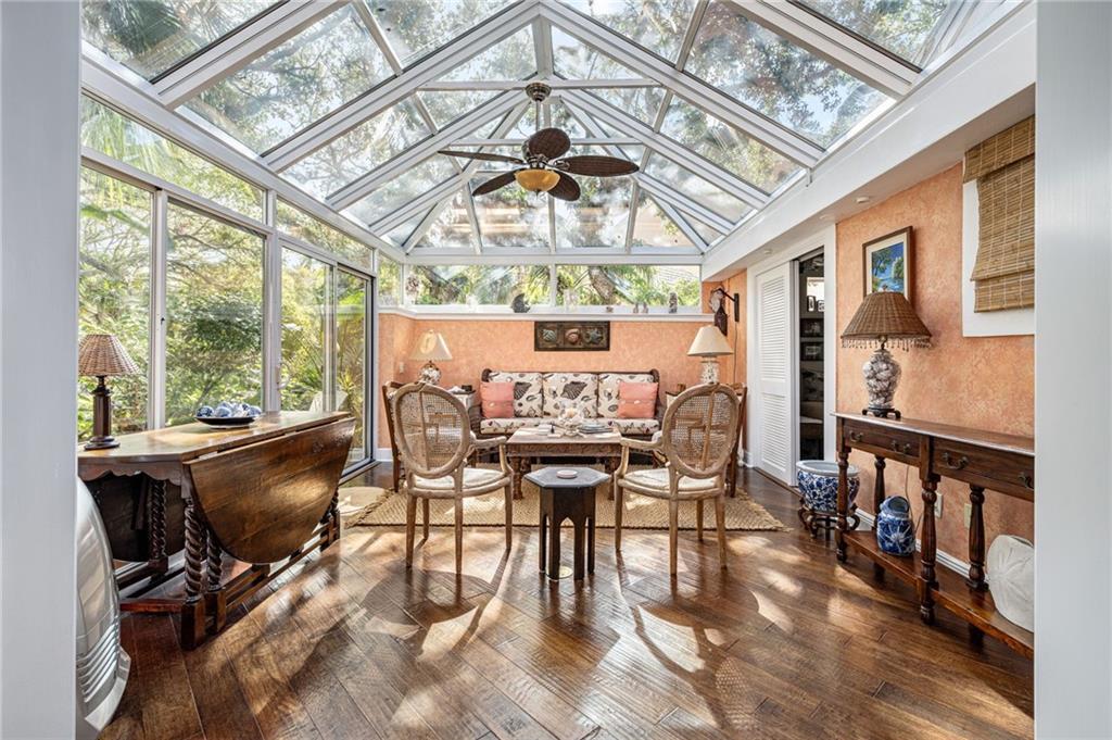 a view of a dining room with furniture window and wooden floor