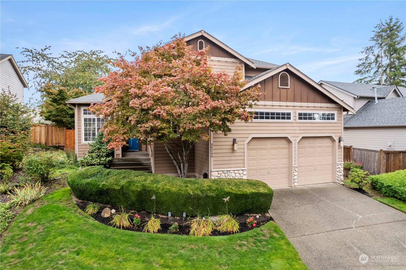 a front view of a house with a yard