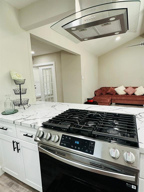 Kitchen Open view to living room - gas range oven