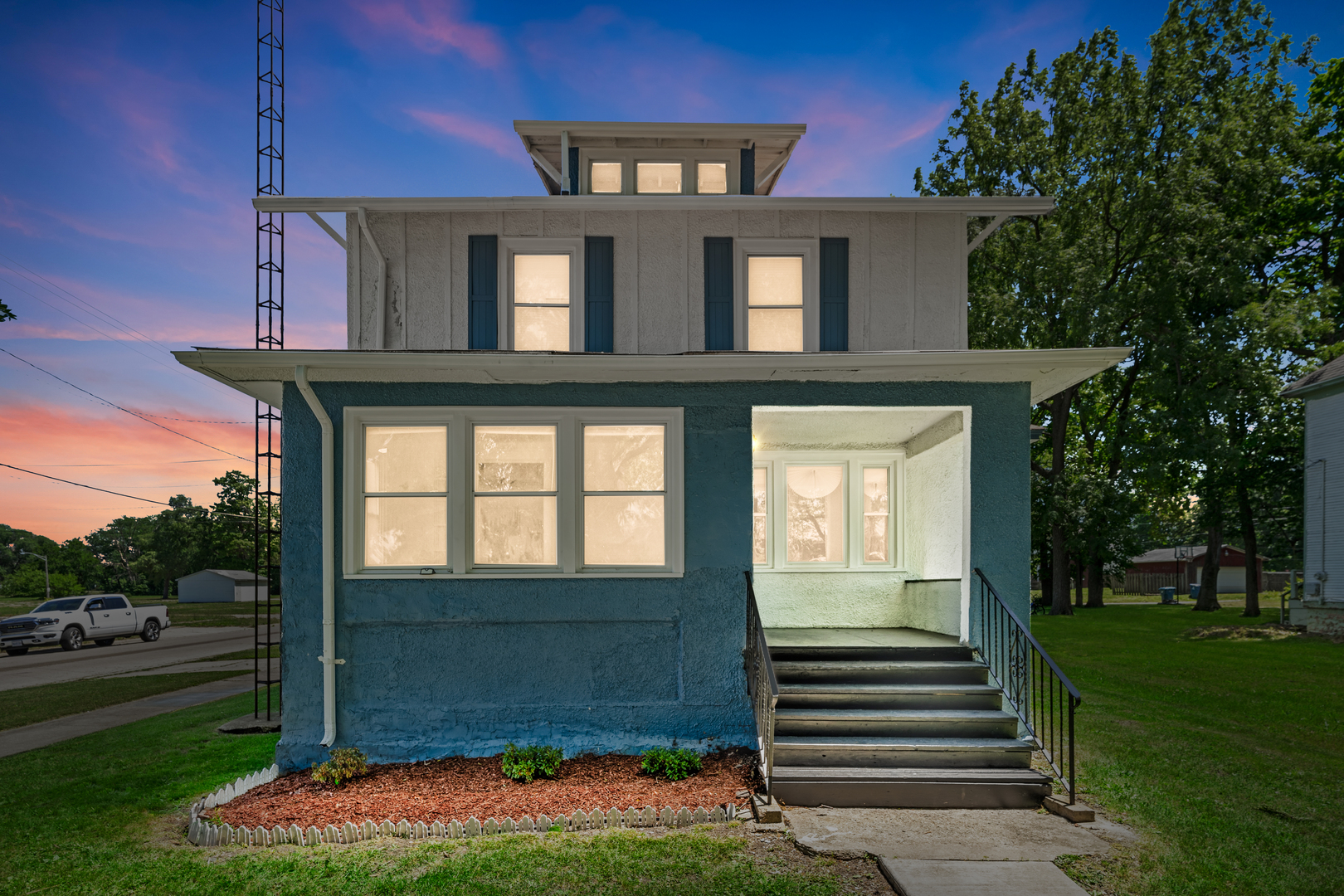 a front view of a house with a yard