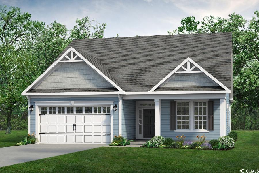 View of front facade featuring a porch, a garage,