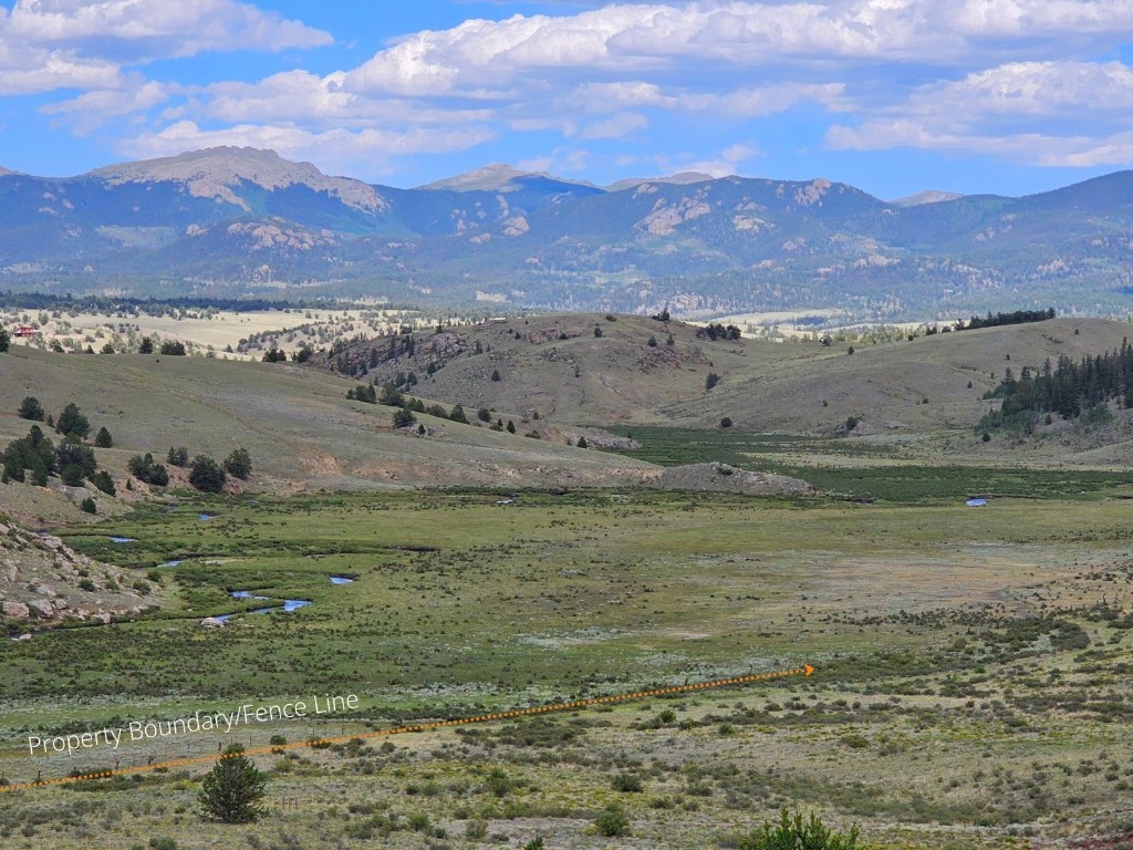 a view of a lake with mountains in the background