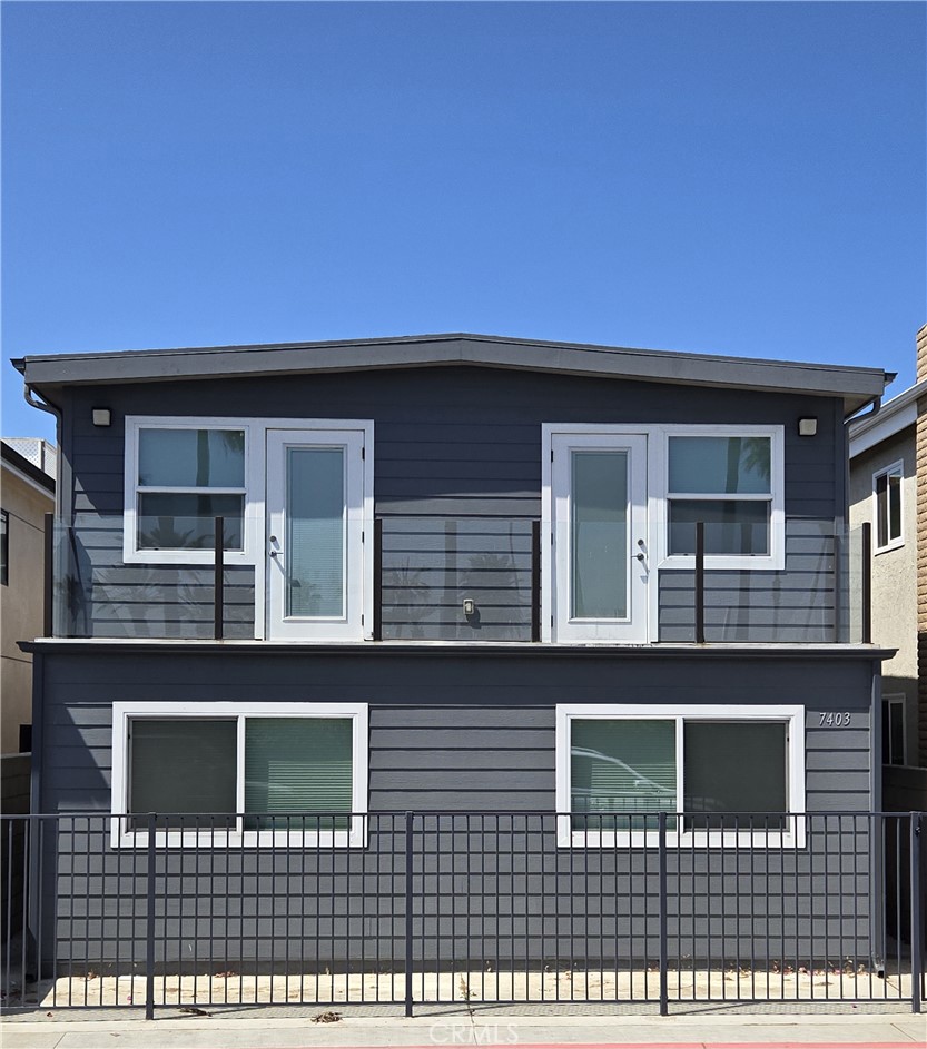 a front view of a house with glass windows