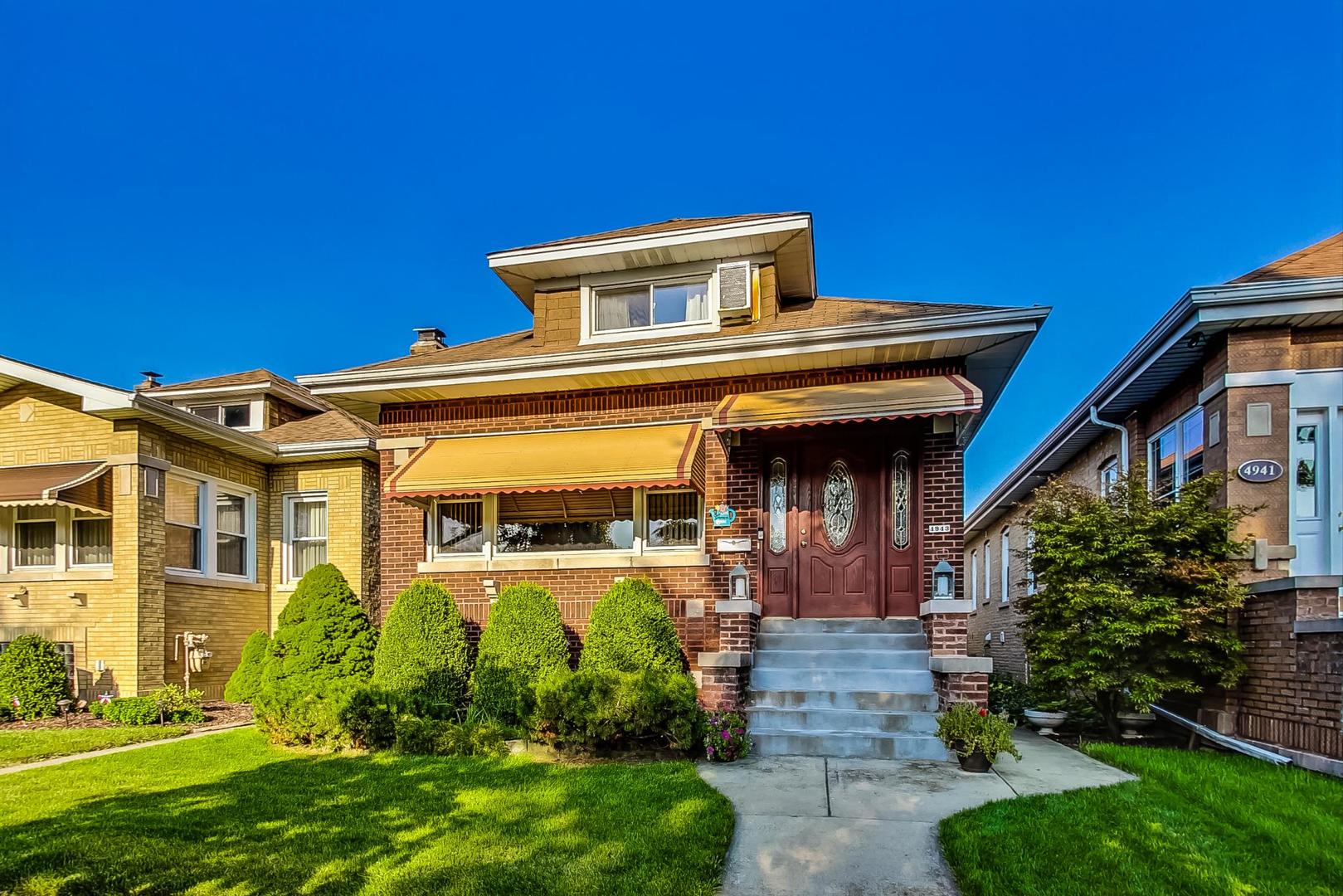 front view of a house with a small yard