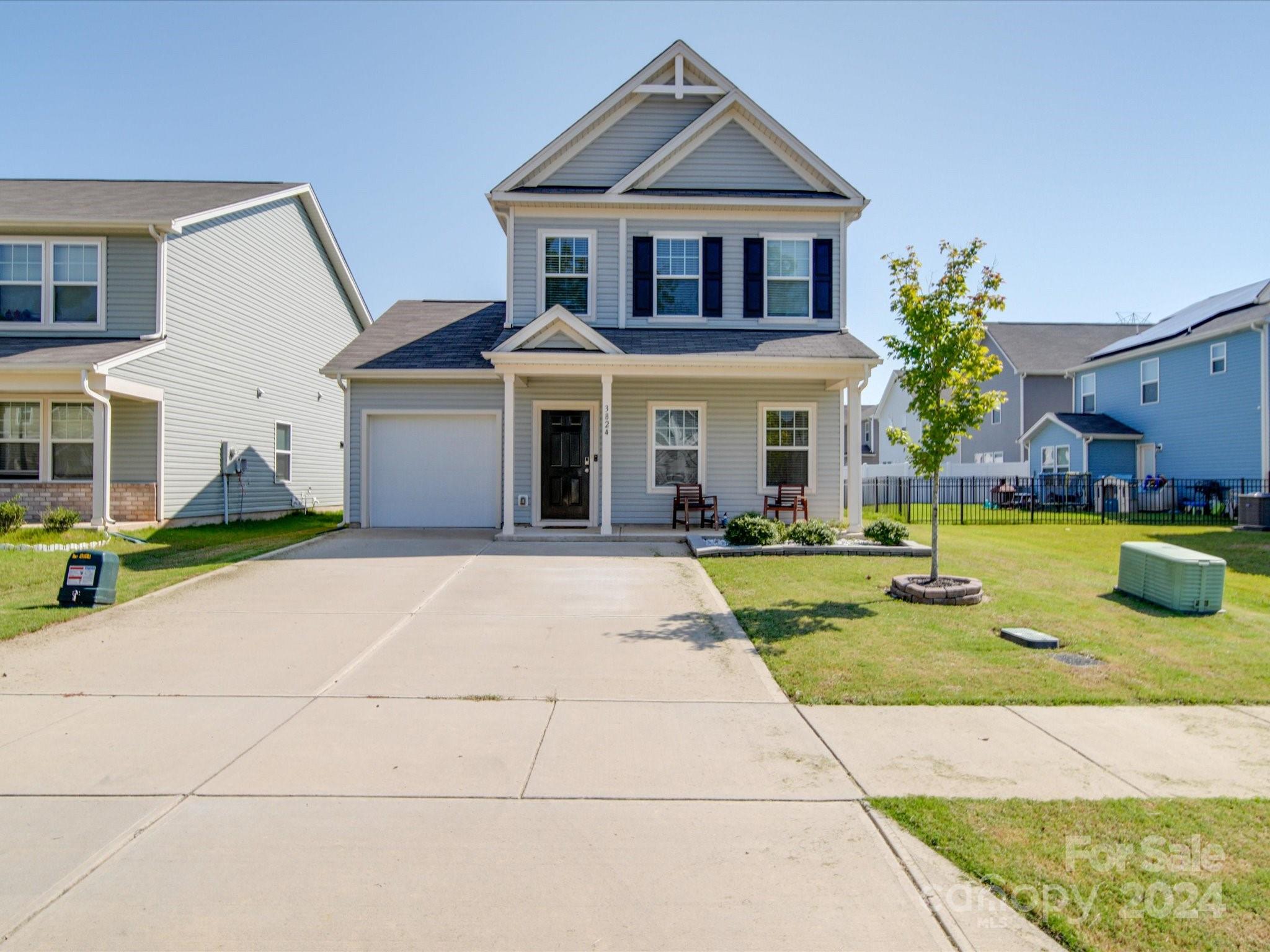 a front view of a house with that has a yard