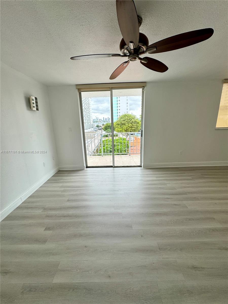 a view of room window and wooden floor