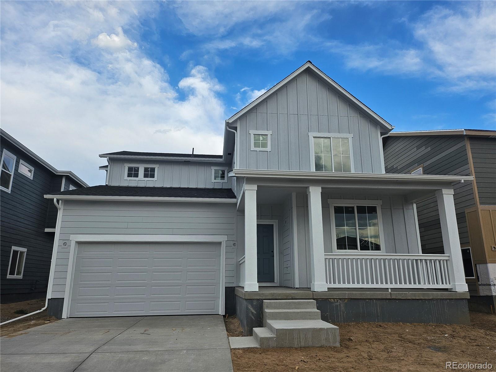 a front view of a house with a garage