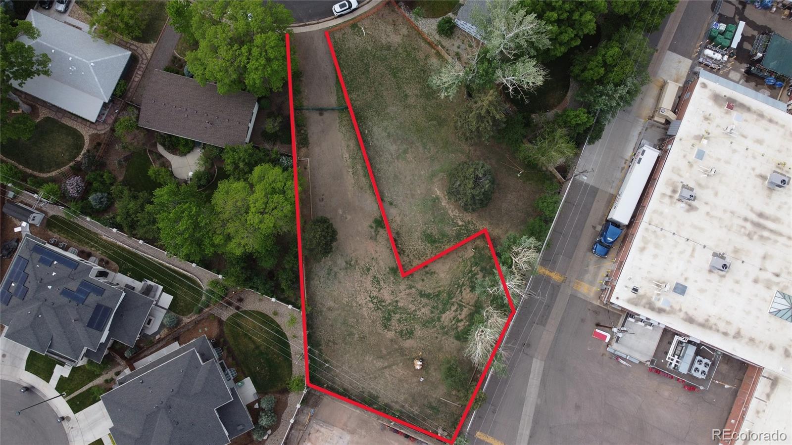 an aerial view of a house with outdoor space