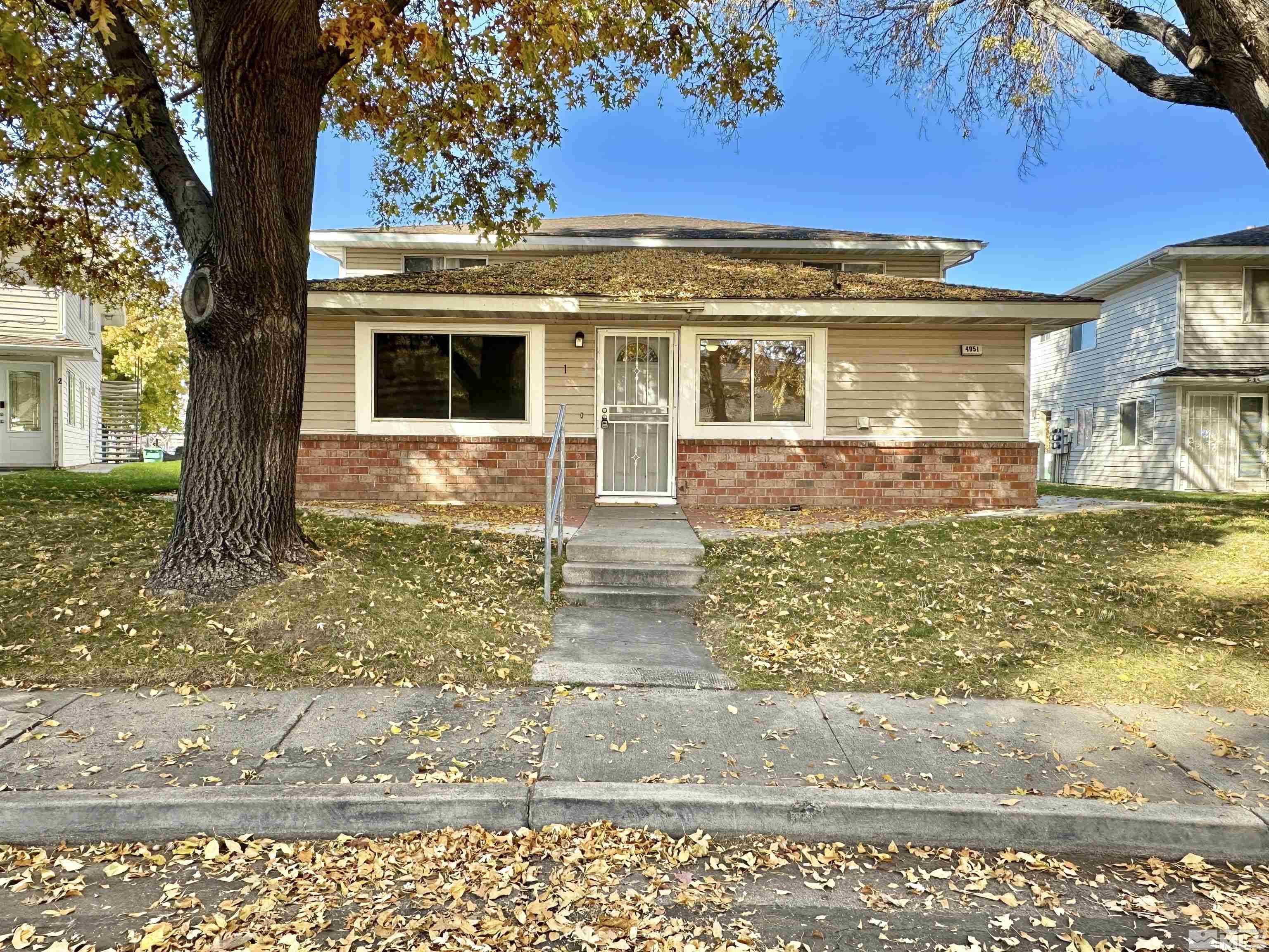 a view of a house with a yard