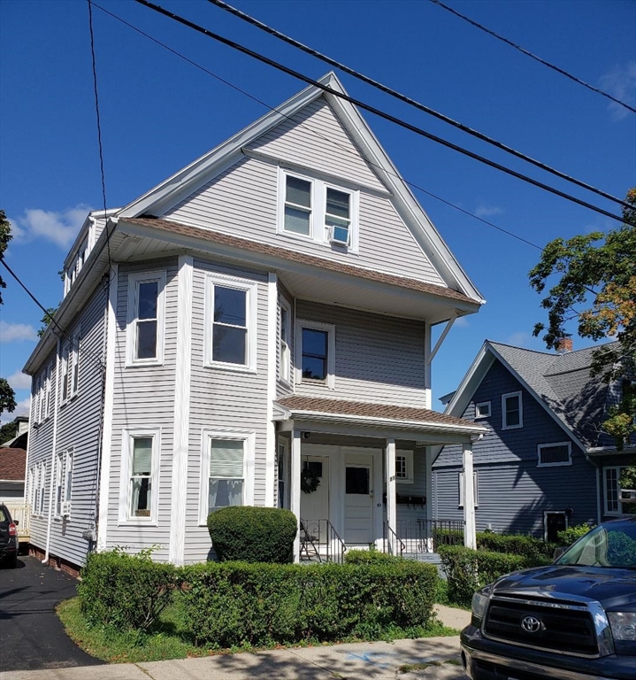 a front view of a house with garage