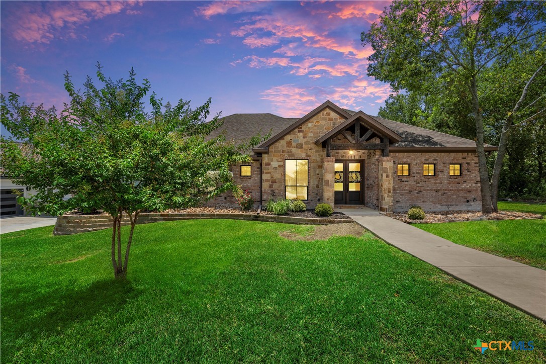 a front view of a house with a yard