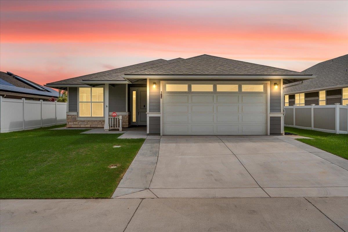 front view of a house with a yard