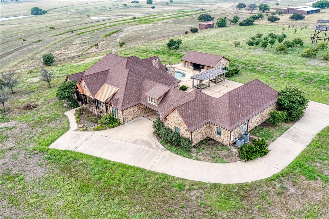 an aerial view of a house with outdoor space