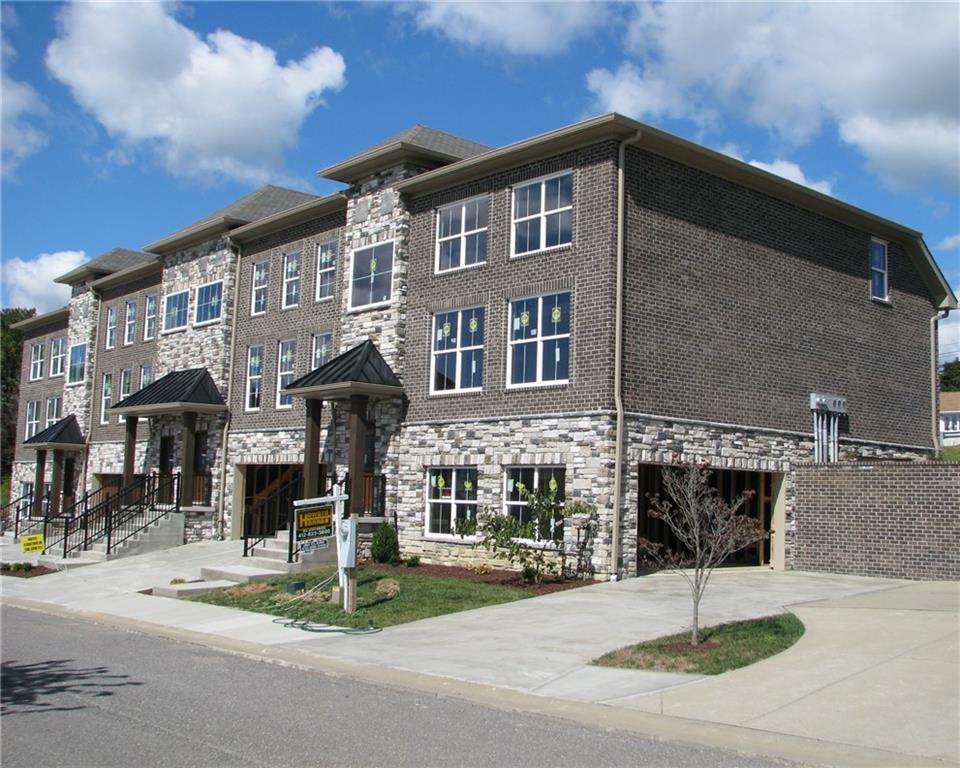 a front view of a building with street view