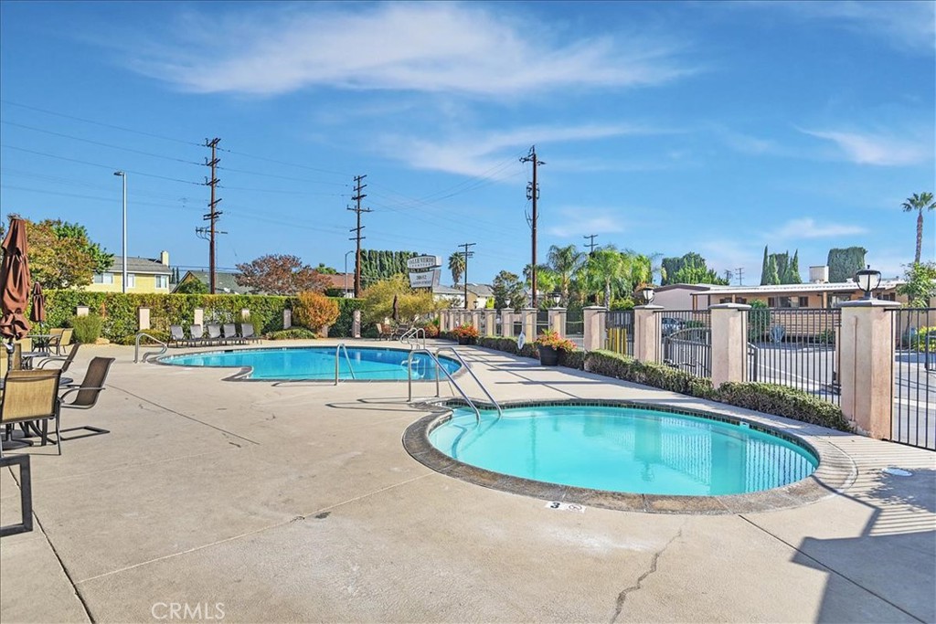 a view of a swimming pool with a sitting space