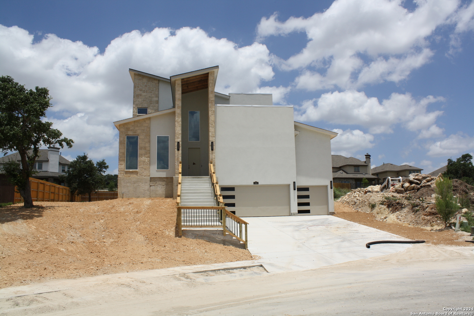 a view of a house with a snow in the background