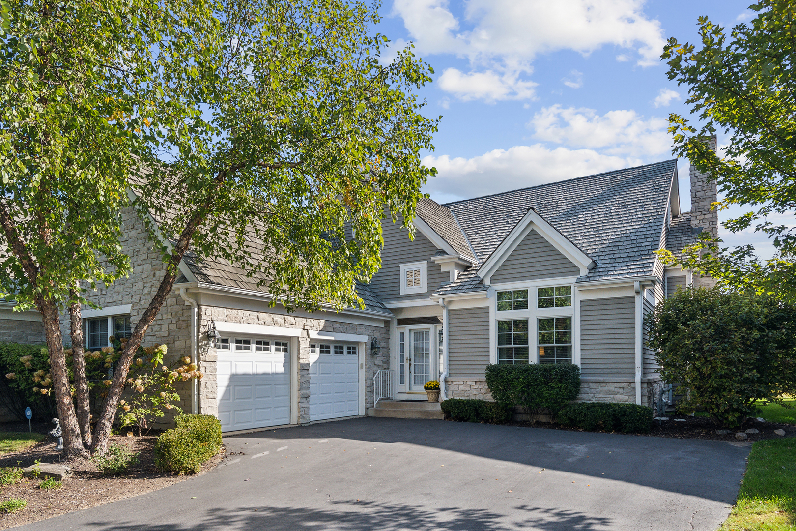 front view of a house with a yard