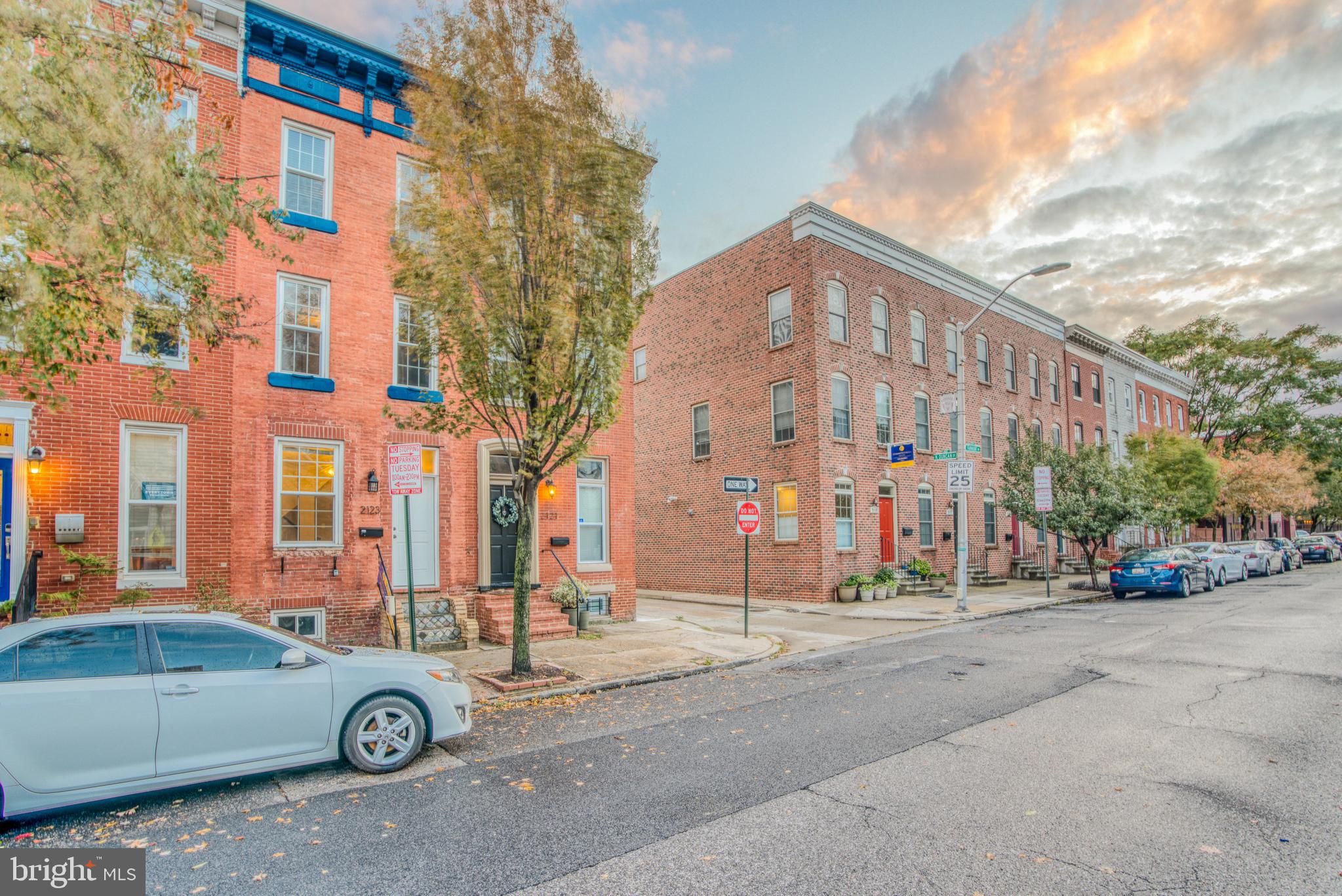 a front view of a building with parking