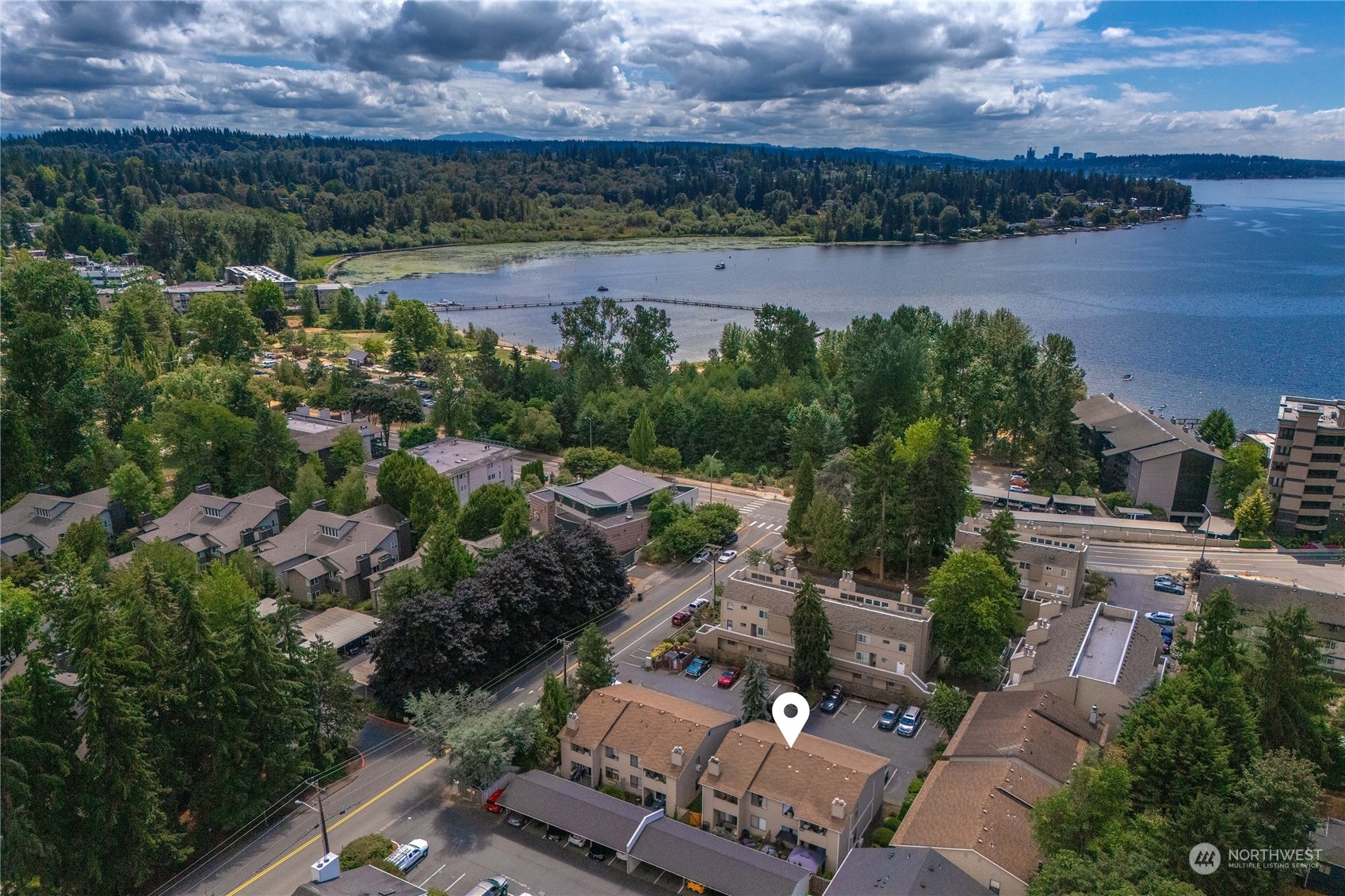 an aerial view of a house with a lake view