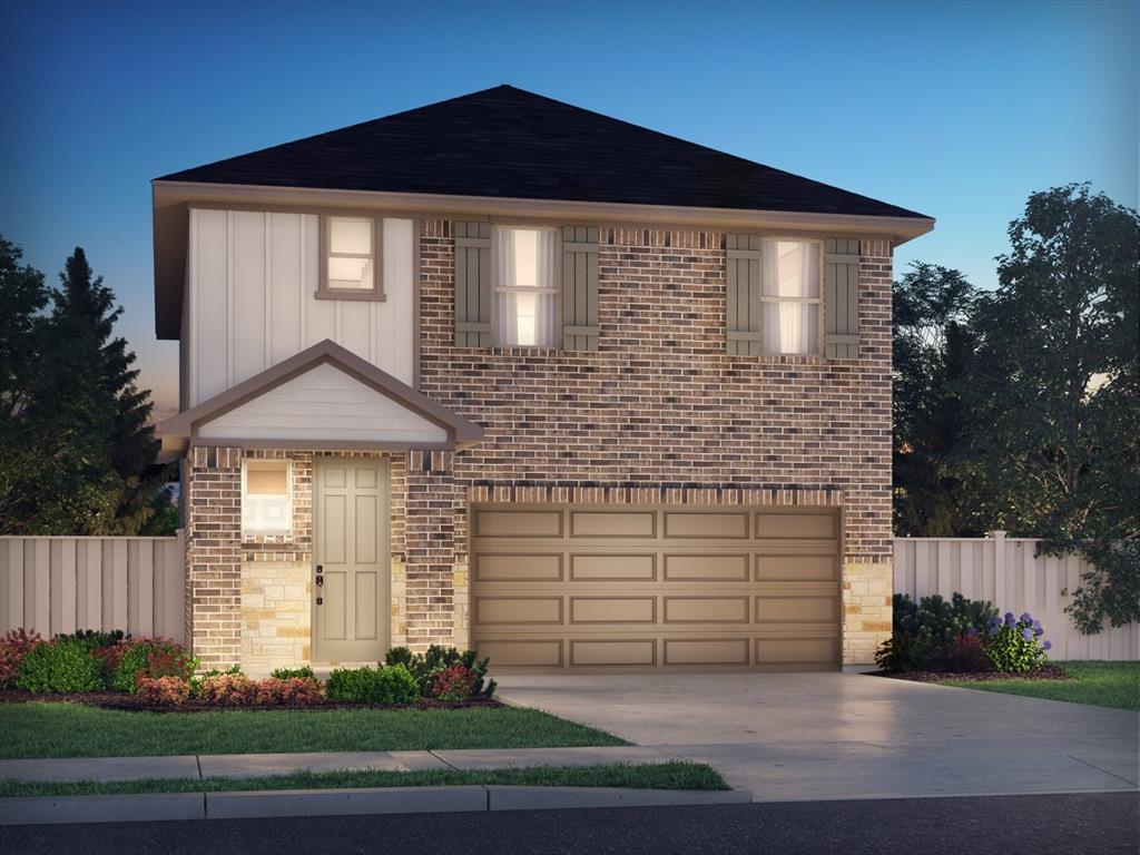 a front view of a house with garage