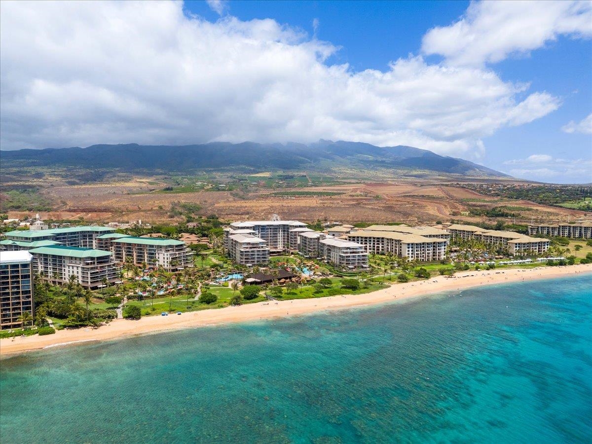 an aerial view of residential building and ocean view