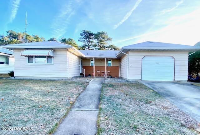 a view of a house with a yard and garage