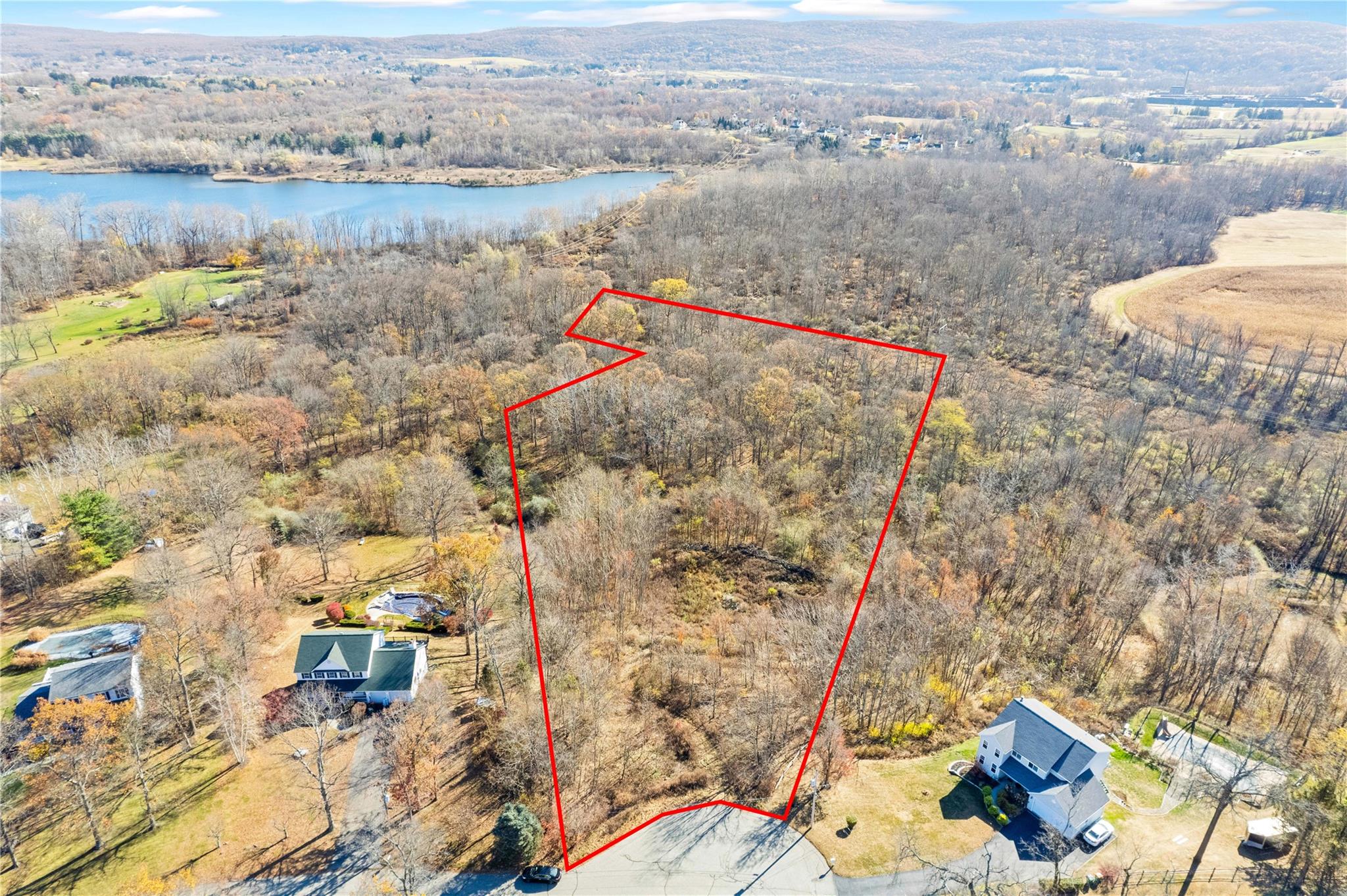 an aerial view of a house with a lake view