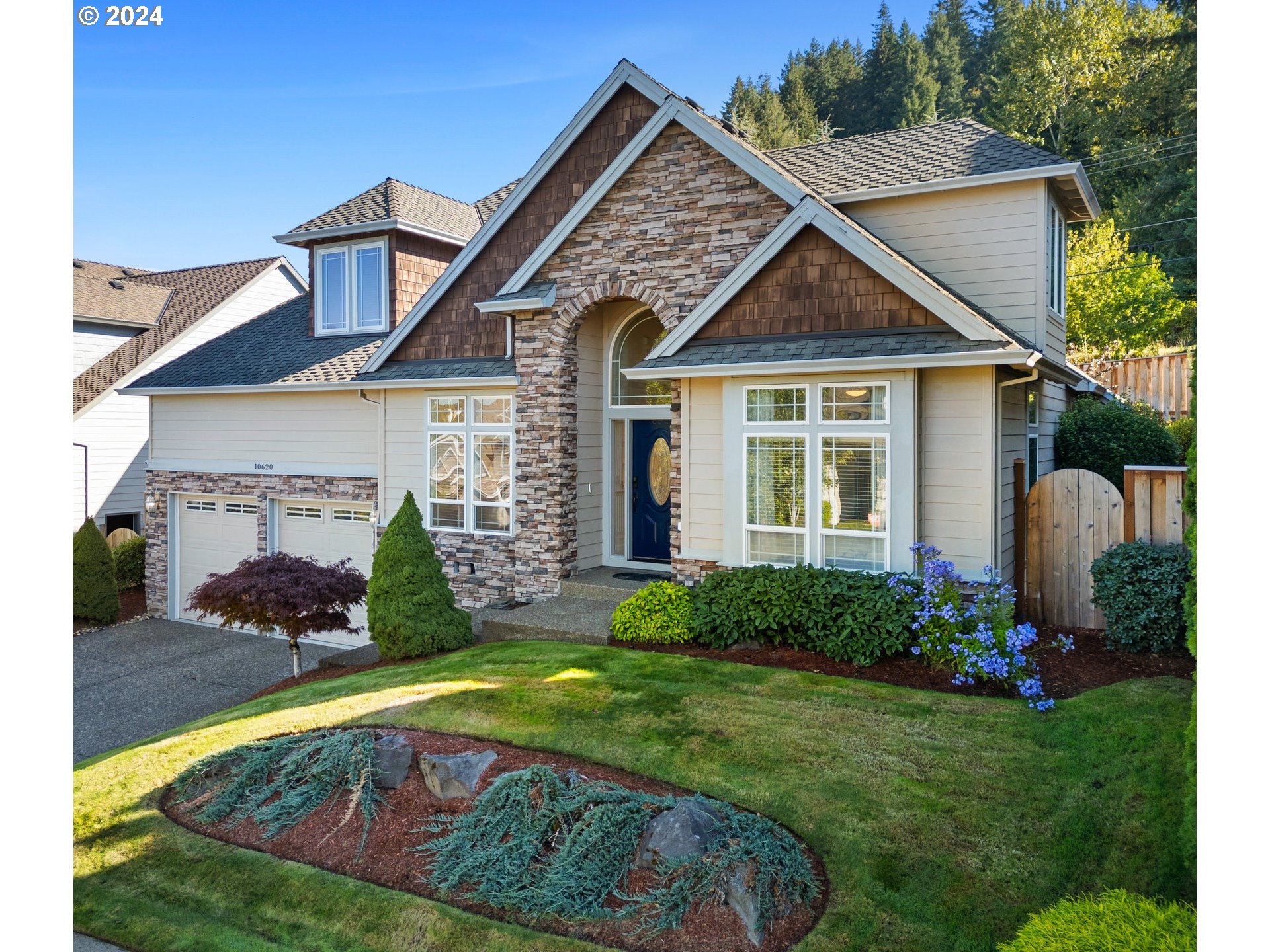 a front view of a house with garden