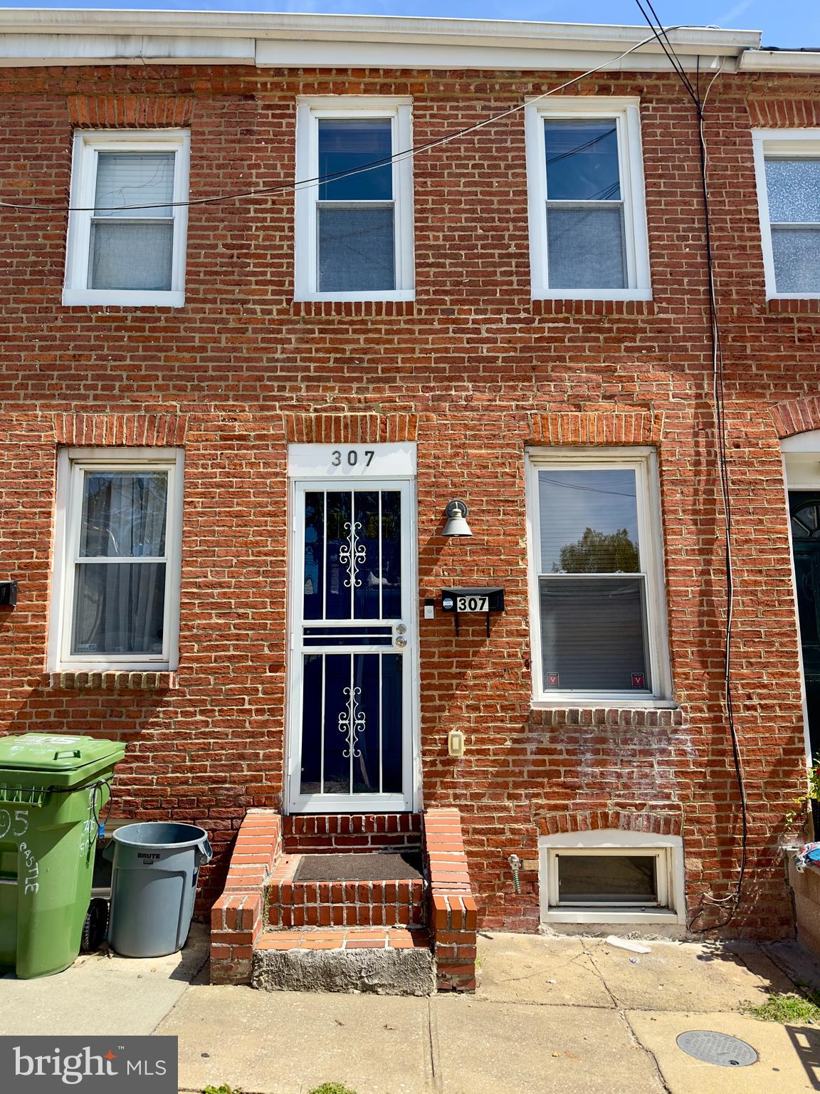 a brick house with a door and a window