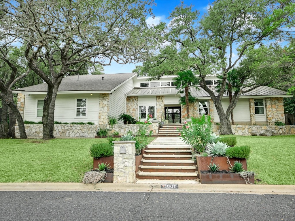 front view of a house with a yard