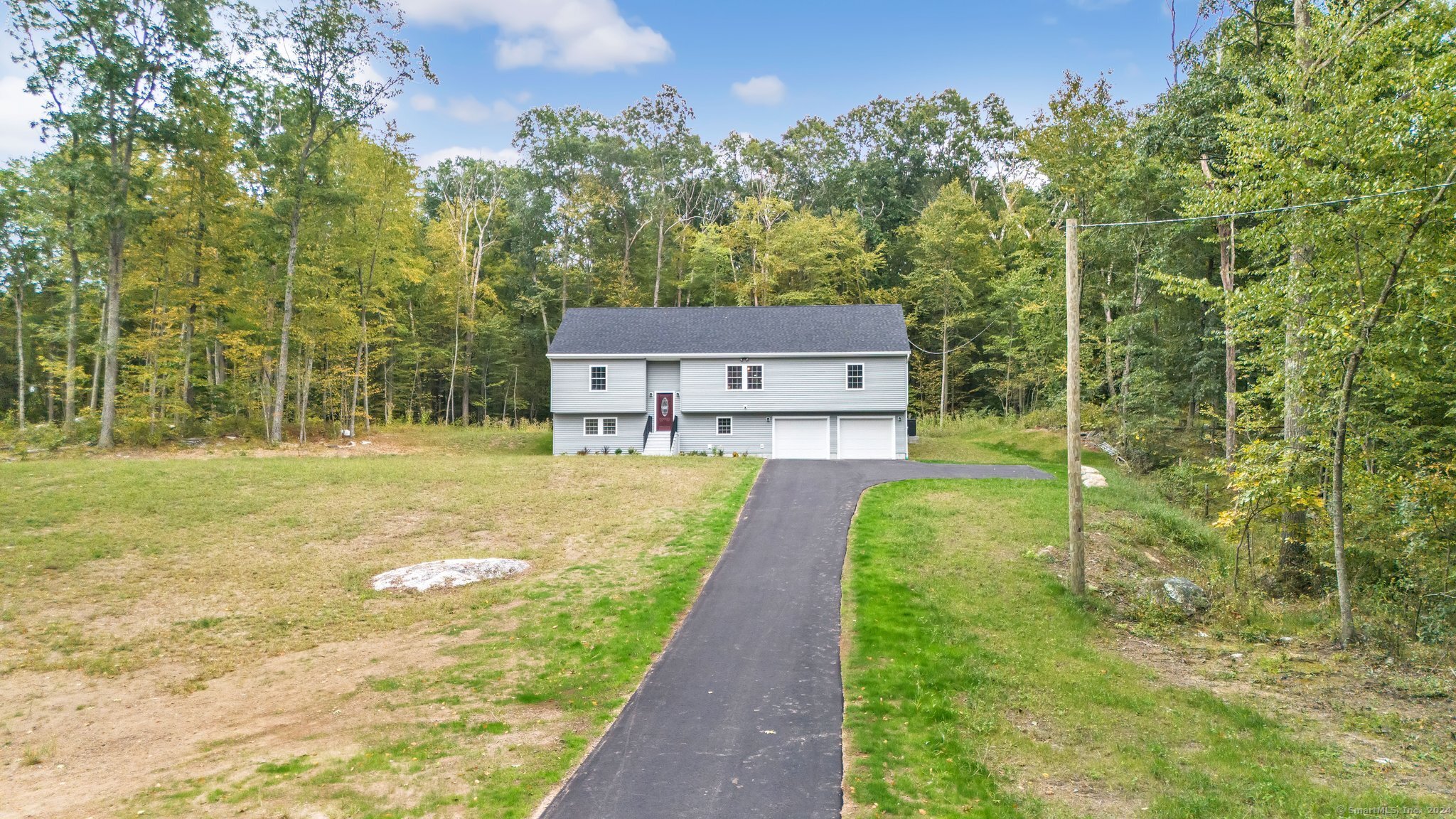 a view of a house with a yard