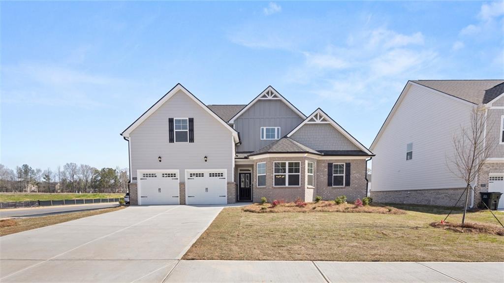 a front view of a house with a yard