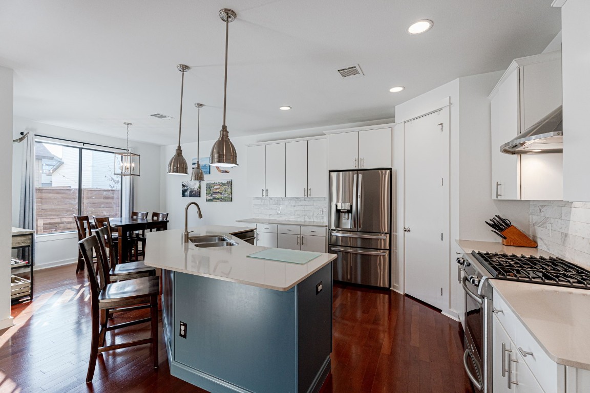 Ovesized Kitchen island offers ample countertop space for dining, preparation and storage