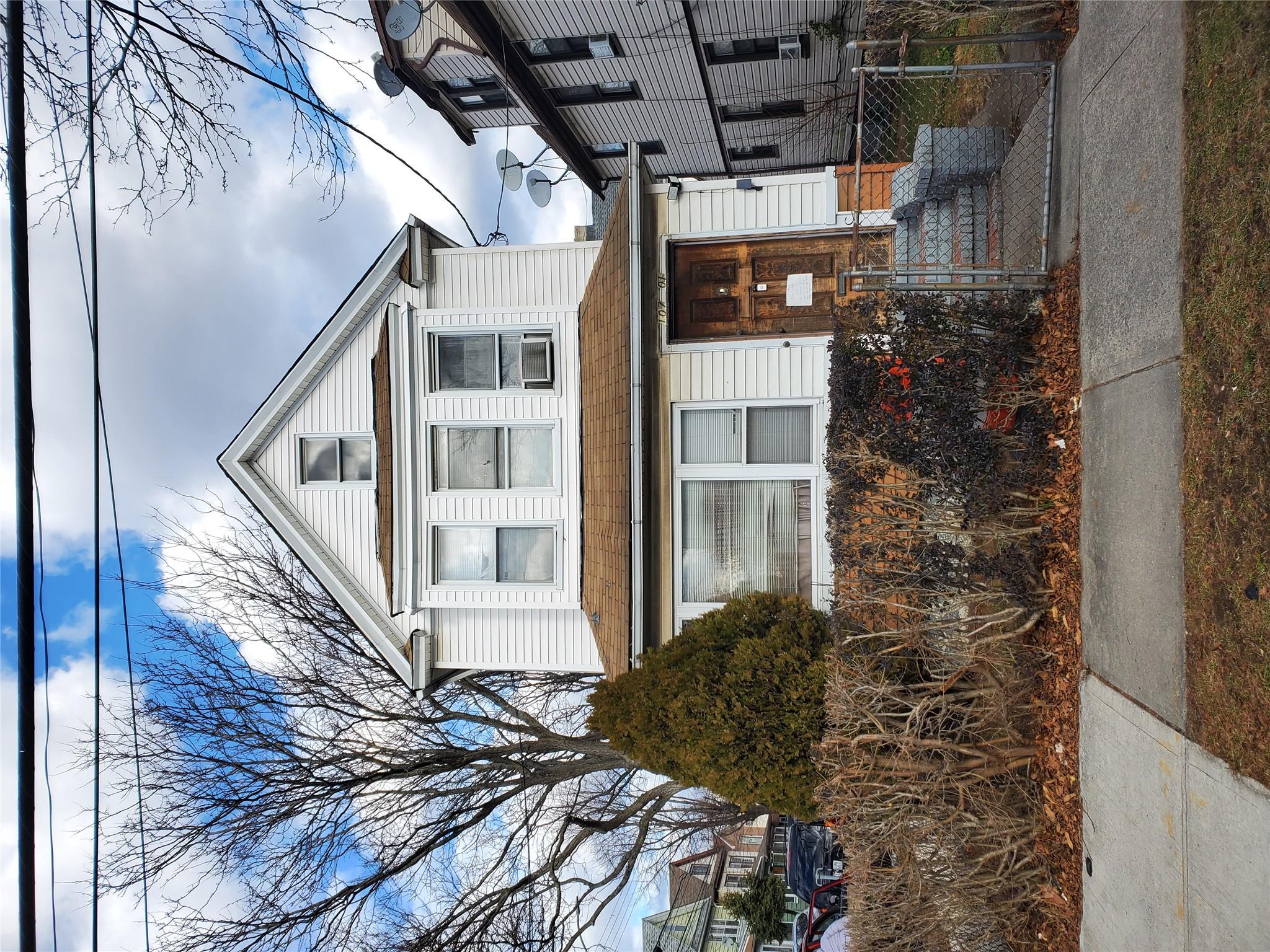 View of front of home featuring cooling unit