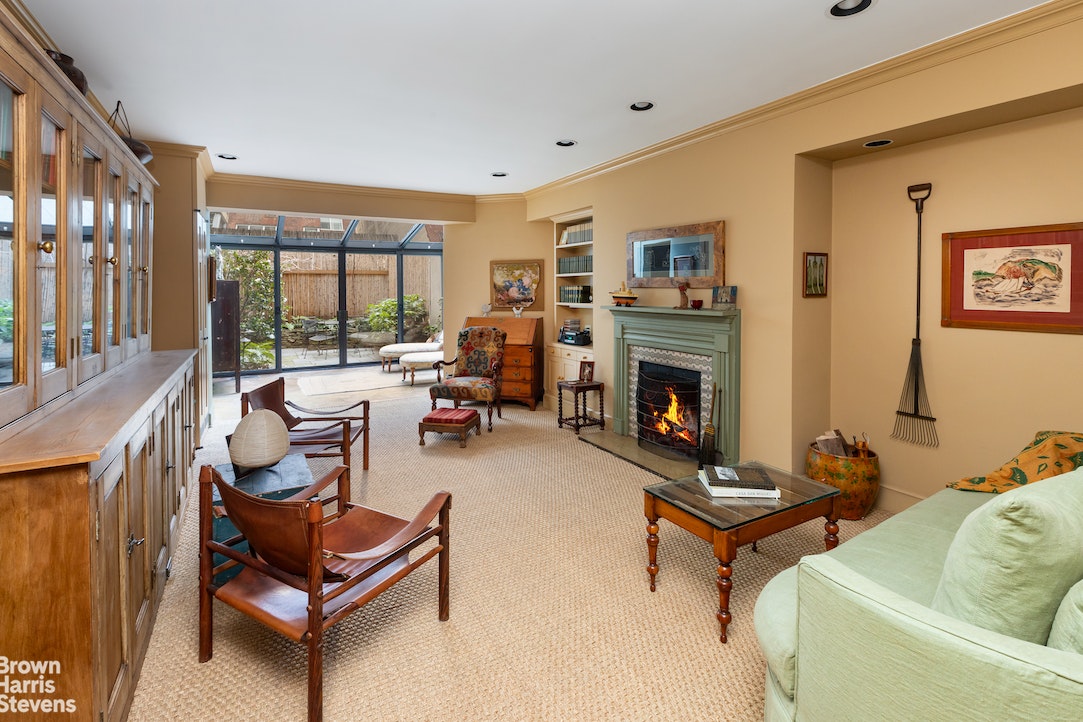 a living room with furniture fireplace and a flat screen tv